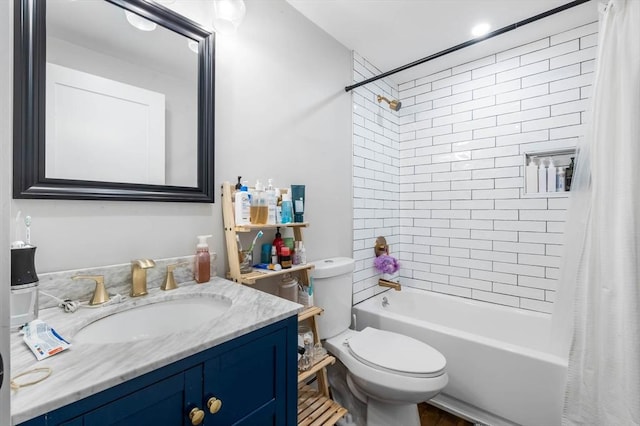 full bath featuring shower / tub combo with curtain, toilet, and vanity