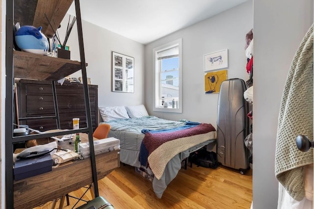 bedroom featuring wood finished floors