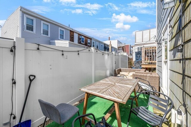 view of patio / terrace featuring fence