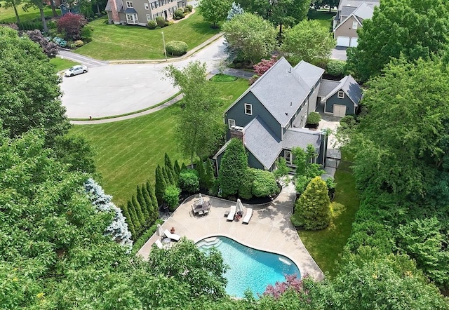 birds eye view of property with a residential view