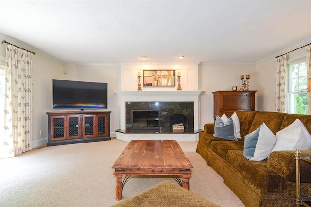 carpeted living area with ornamental molding, baseboards, and a premium fireplace