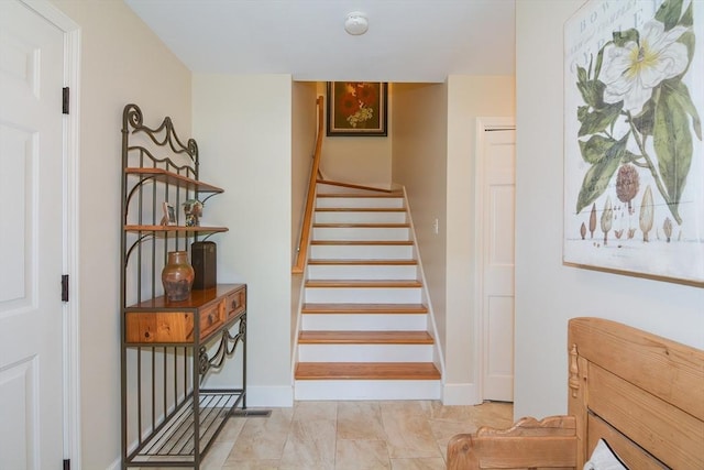 staircase with baseboards