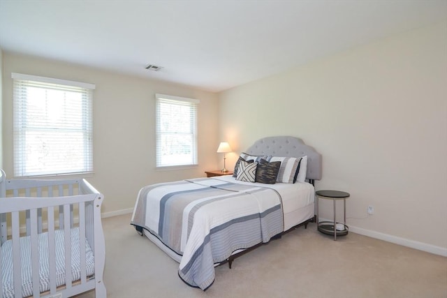 bedroom featuring carpet flooring, visible vents, and baseboards