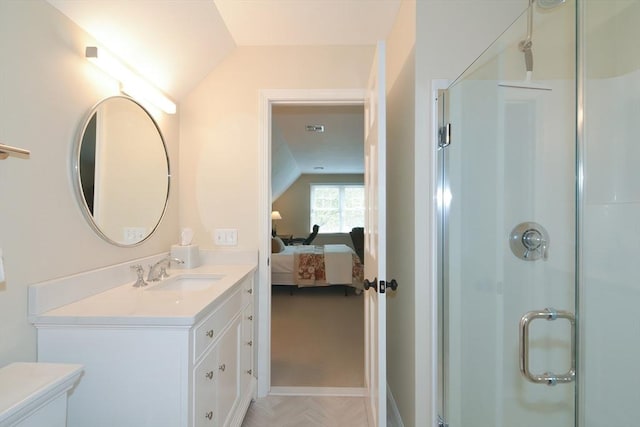 full bathroom featuring visible vents, vanity, vaulted ceiling, a shower stall, and ensuite bath