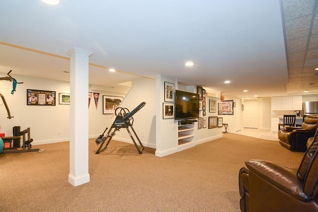 workout room featuring recessed lighting, light colored carpet, and baseboards