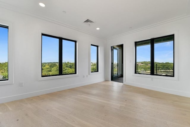 50 Leo M Birmingham Pkwy Unit 501, Boston, MA 02135 - spare room with ornamental molding, light wood-type flooring, baseboards, and recessed lighting