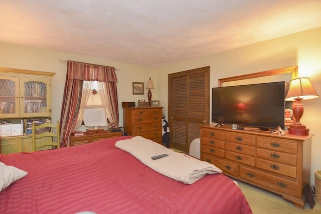 carpeted bedroom with a closet