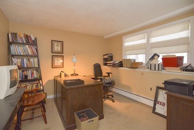 carpeted home office featuring a baseboard heating unit