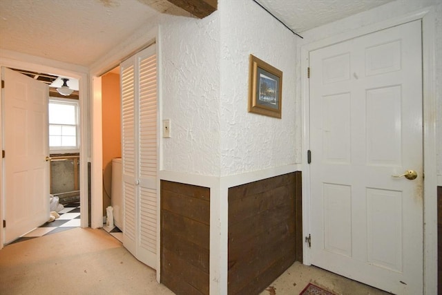 hallway featuring a textured ceiling