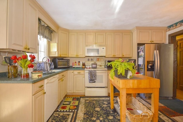 kitchen featuring white appliances and sink