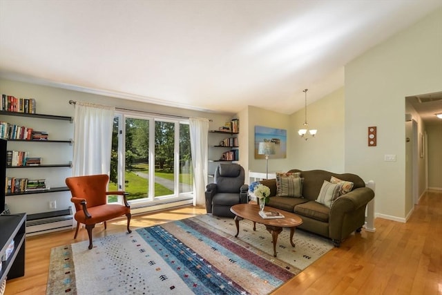 living room with lofted ceiling, light hardwood / wood-style floors, and a notable chandelier