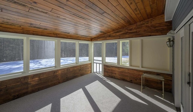 unfurnished sunroom featuring vaulted ceiling and wooden ceiling