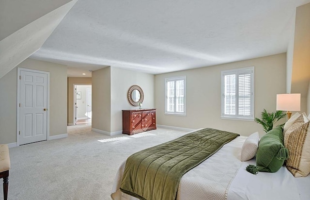 carpeted bedroom featuring a textured ceiling