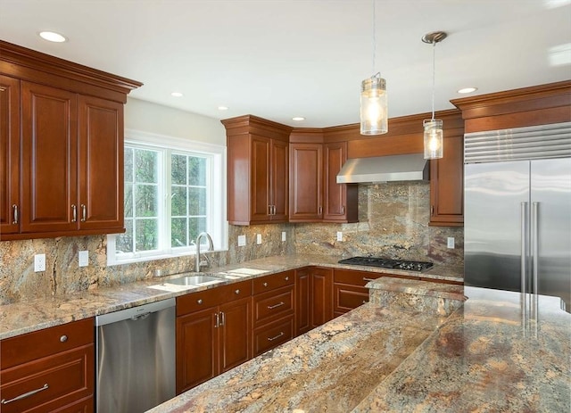 kitchen with decorative light fixtures, sink, decorative backsplash, stainless steel appliances, and wall chimney range hood