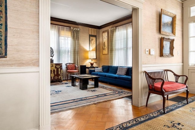 sitting room with parquet floors and crown molding