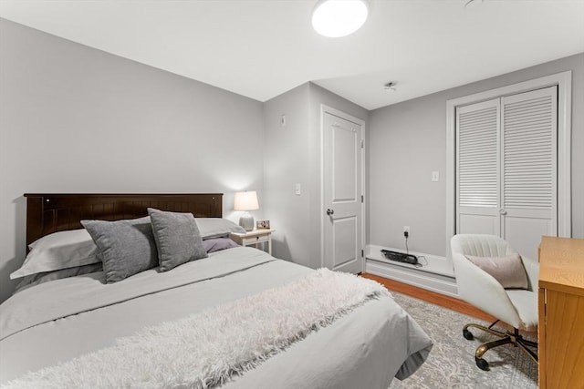 bedroom with hardwood / wood-style floors