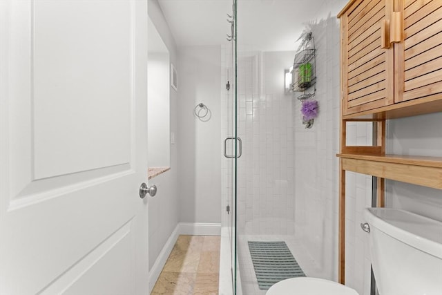 bathroom with toilet and walk in shower