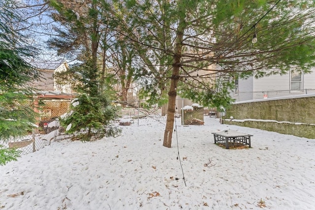 view of yard layered in snow