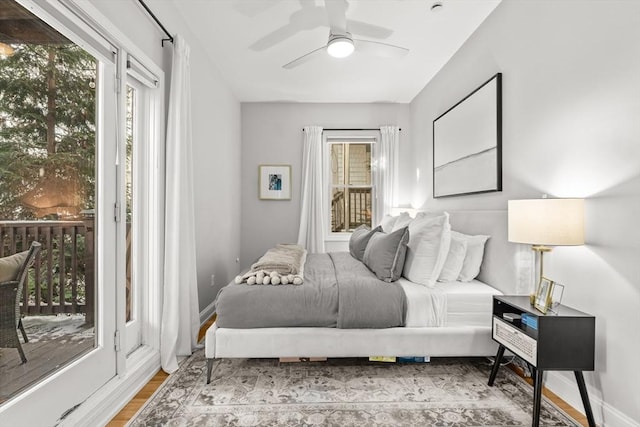 bedroom featuring ceiling fan, access to outside, and light hardwood / wood-style flooring