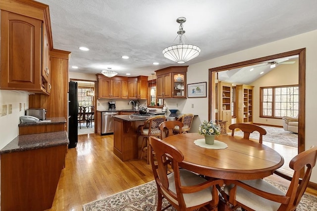 dining room featuring recessed lighting, ceiling fan, lofted ceiling, and light wood-style floors
