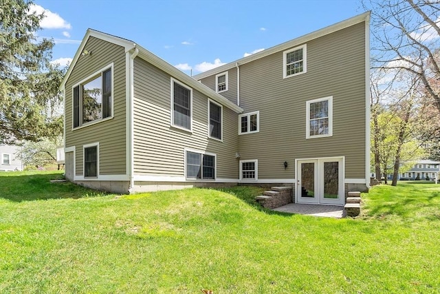back of house featuring a yard