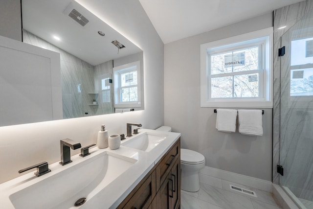 bathroom with vanity, toilet, lofted ceiling, and walk in shower