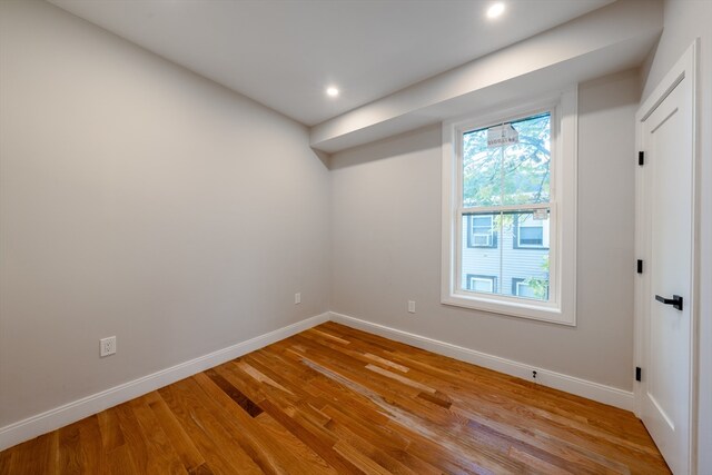 spare room with light hardwood / wood-style flooring