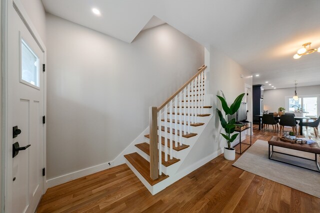 staircase with wood-type flooring