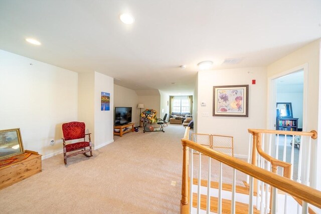 23 Kendall Ct Unit 23, Bedford, MA 01730 - living area featuring carpet floors, baseboards, an upstairs landing, and recessed lighting