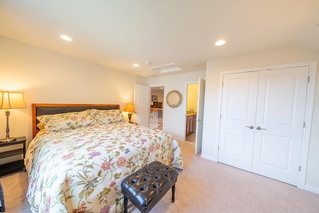 23 Kendall Ct Unit 23, Bedford, MA 01730 - bedroom with a closet, baseboards, recessed lighting, attic access, and light colored carpet