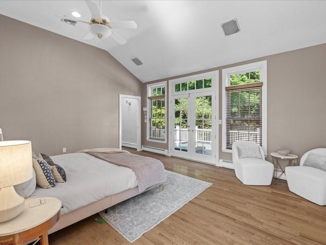 bedroom featuring french doors, lofted ceiling, light wood-type flooring, a baseboard radiator, and access to exterior