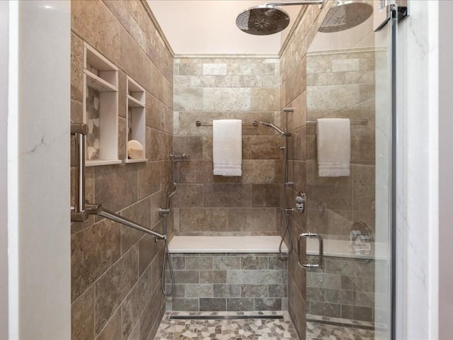 bathroom with a shower with shower door