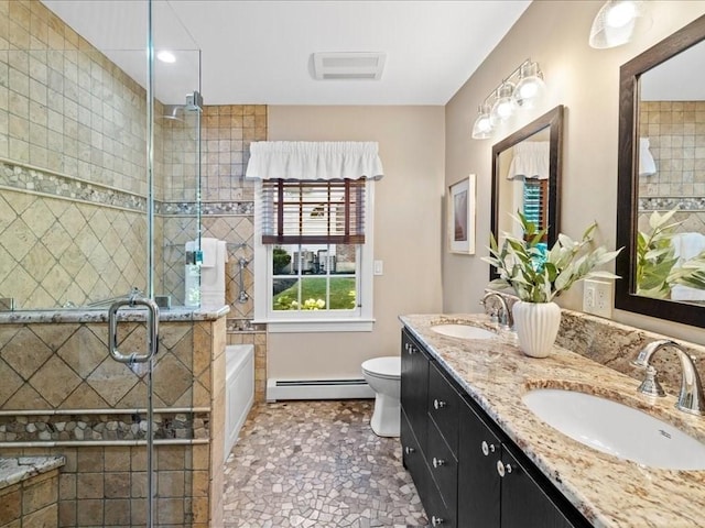 full bathroom featuring a baseboard radiator, vanity, toilet, and shower with separate bathtub