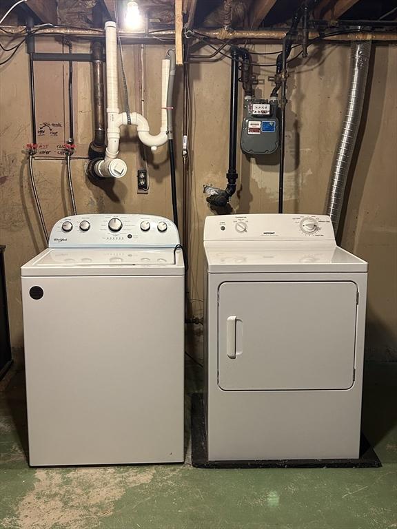 laundry area featuring washing machine and clothes dryer