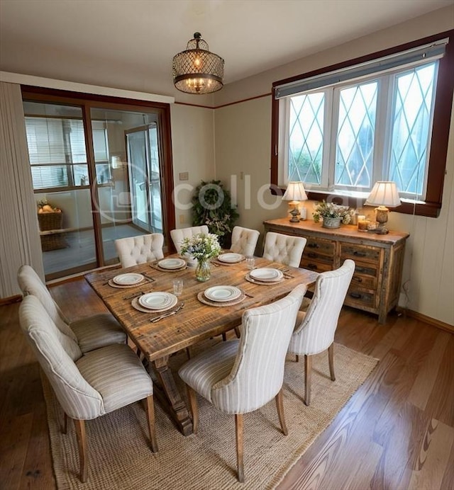 dining area with hardwood / wood-style floors