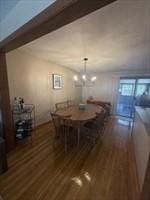 dining area with wood finished floors