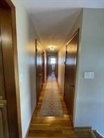 corridor with wood finished floors