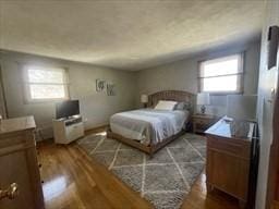 bedroom featuring dark wood-style flooring