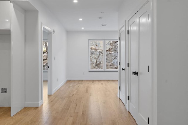 corridor featuring light hardwood / wood-style flooring