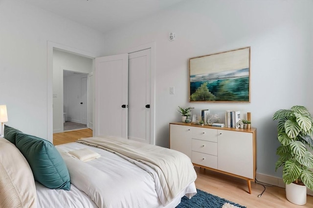 bedroom featuring light wood-type flooring