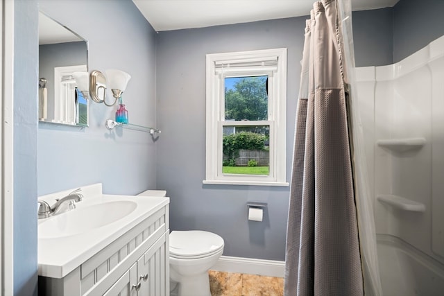 bathroom featuring a shower, tile patterned floors, toilet, and vanity