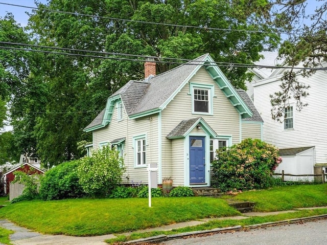 21 Chapel St Unit 21, Newburyport, MA 01950 - view of front of house featuring a chimney and a shingled roof