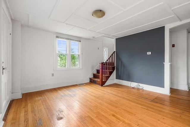 21 Chapel St Unit 21, Newburyport, MA 01950 - unfurnished living room featuring light wood-type flooring and stairs