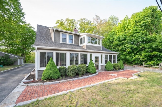 272 County St, Seekonk, MA 02771 - view of front of property with a chimney, a shingled roof, and a front yard