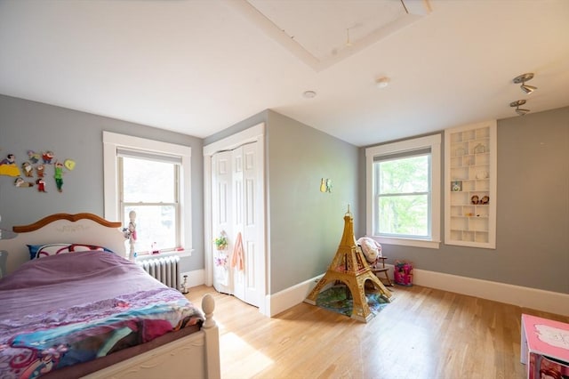 272 County St, Seekonk, MA 02771 - bedroom featuring radiator, light wood-style floors, baseboards, a closet, and lofted ceiling