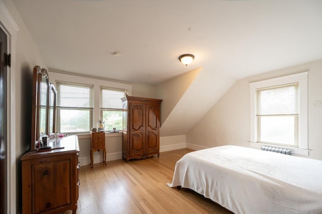 272 County St, Seekonk, MA 02771 - bedroom with light wood-type flooring, vaulted ceiling, baseboards, and radiator