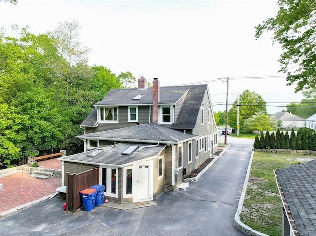 272 County St, Seekonk, MA 02771 - rear view of house with a chimney and a shingled roof