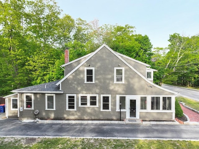 272 County St, Seekonk, MA 02771 - back of property featuring a chimney and view of wooded area