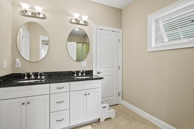 80 Edgemere Ave Unit 80, Northbridge, MA 01588 - bathroom with double vanity and baseboards