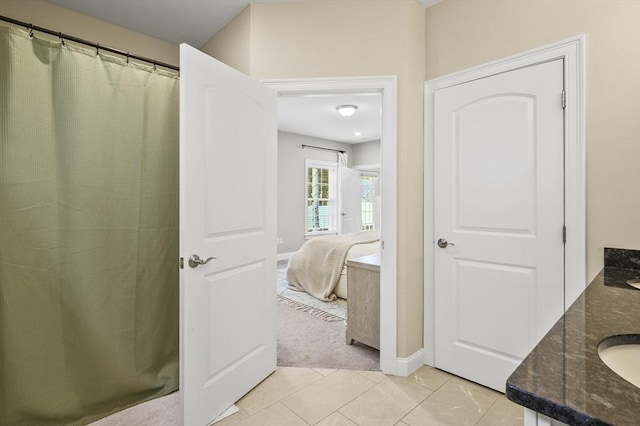 80 Edgemere Ave Unit 80, Northbridge, MA 01588 - bathroom featuring ensuite bath, double vanity, and tile patterned flooring